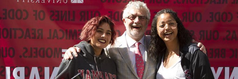 students posing with President Struppa